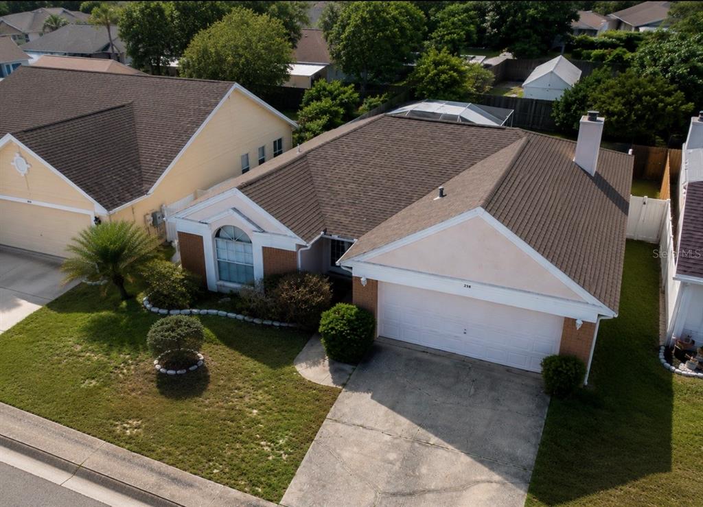 338 Mantis Loop Apopka, FL 32703 - Photo 4 of 11 a view of a house with backyard