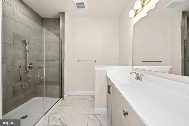 a bathroom with a shower and a bathtub