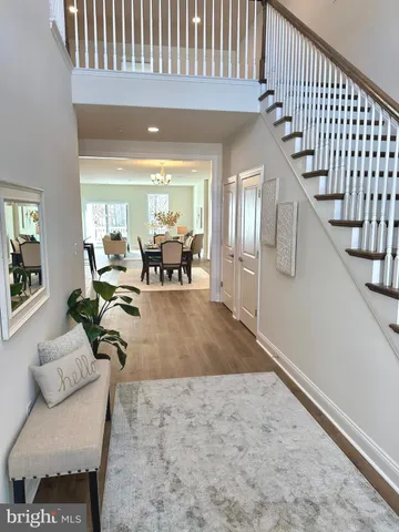 a view of a livingroom with furniture and staircase