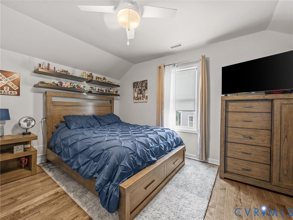 10824 Avening Road Chesterfield, VA 23832 - Photo 34 of 47 a bedroom with a bed and a television
