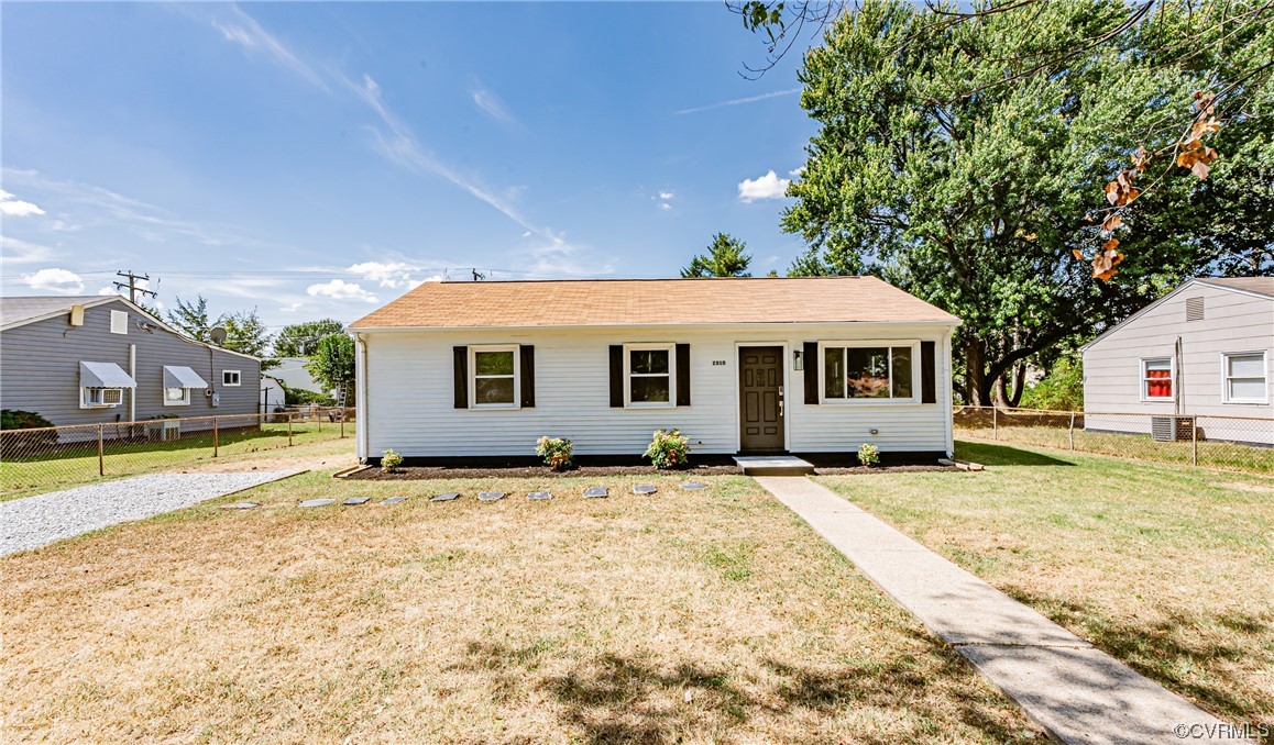 2310 Apollo Road Richmond, VA 23223 - Photo 1 of 22 a front view of a house with a yard
