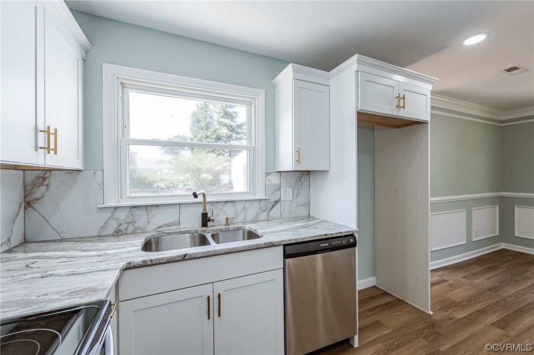 2310 Apollo Road Richmond, VA 23223 - Photo 11 of 22 a kitchen with stainless steel appliances white cabinets a sink and a window