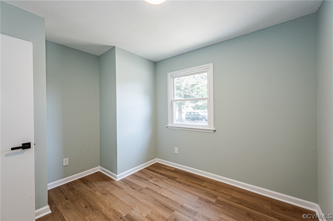2310 Apollo Road Richmond, VA 23223 - Photo 13 of 22 an empty room with wooden floor and closet