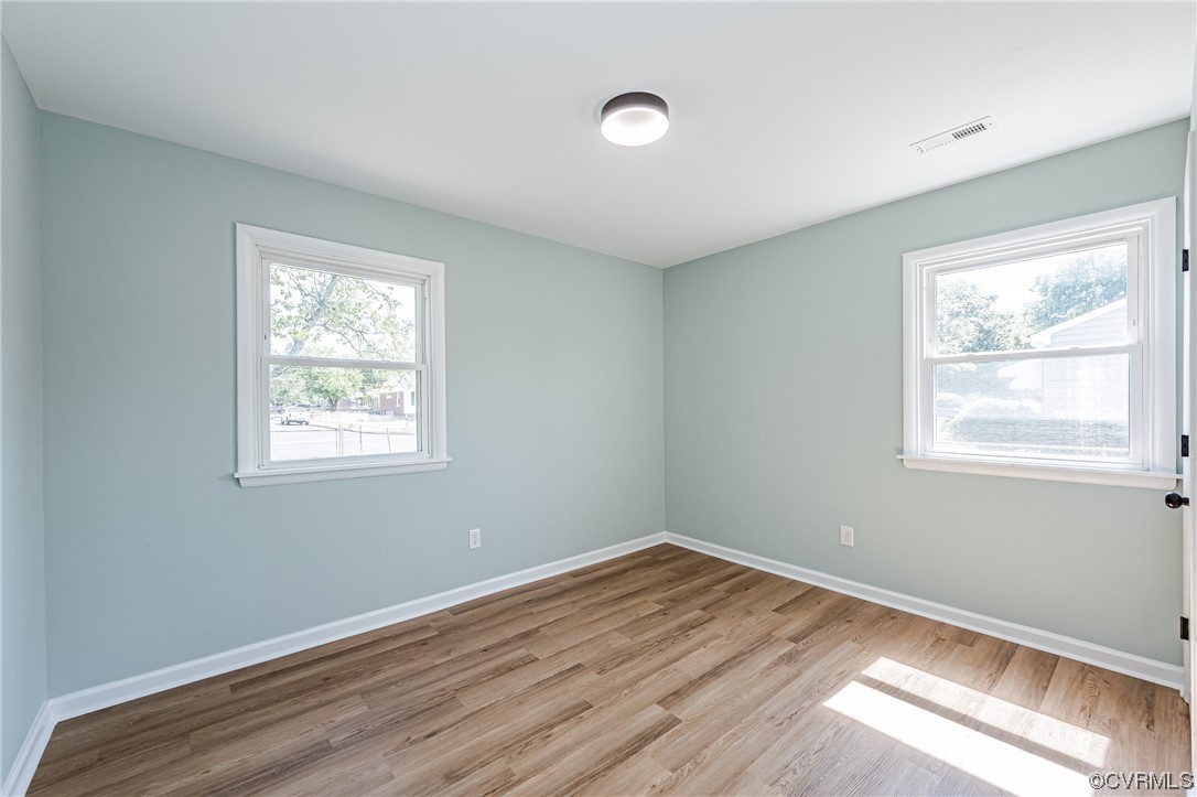 2310 Apollo Road Richmond, VA 23223 - Photo 14 of 22 a view of empty room with wooden floor and fan