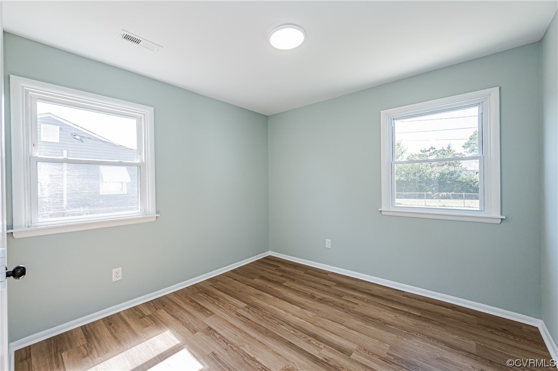 2310 Apollo Road Richmond, VA 23223 - Photo 15 of 22 a view of empty room with wooden floor and fan