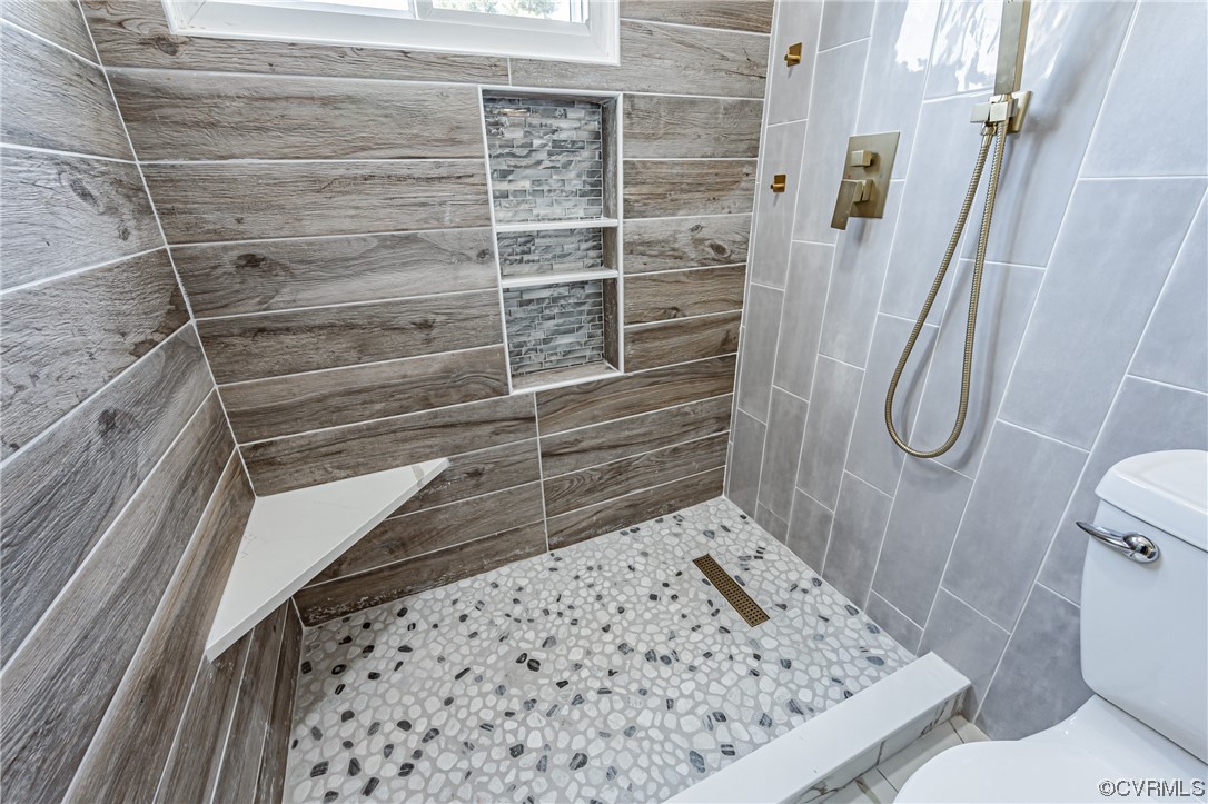 2310 Apollo Road Richmond, VA 23223 - Photo 17 of 22 a bathroom with a toilet and a shower