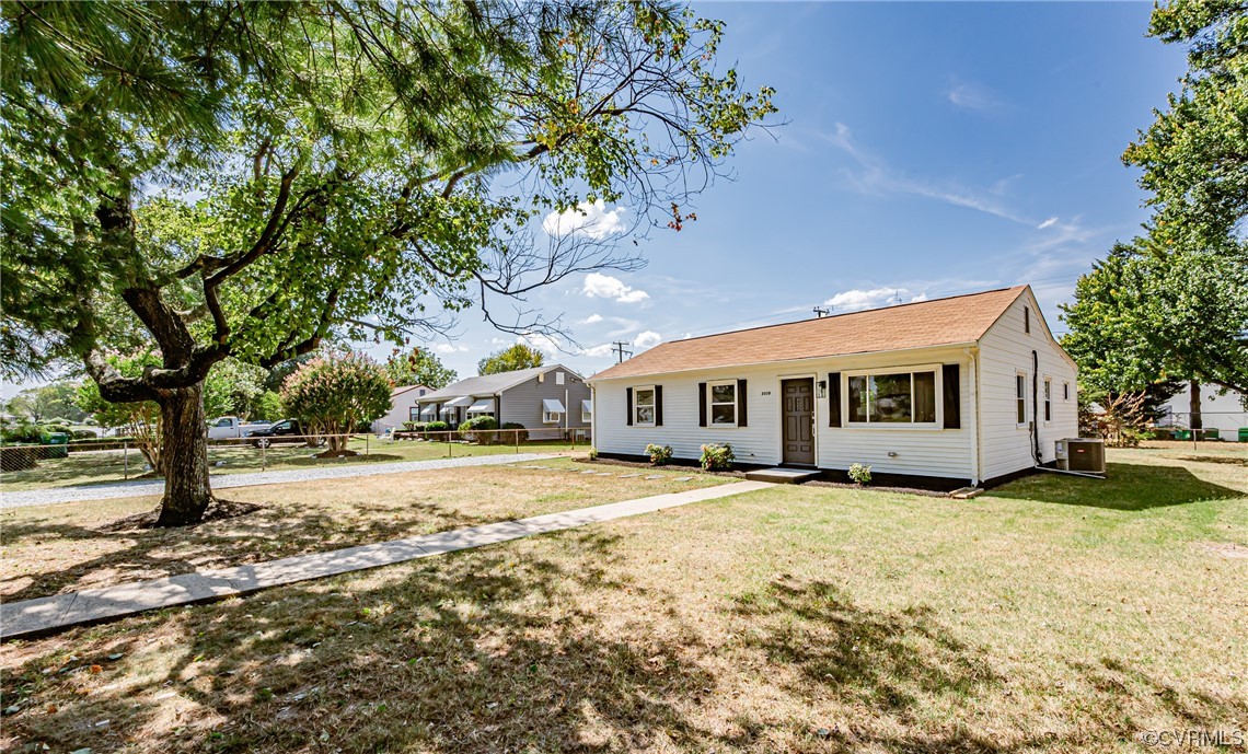 2310 Apollo Road Richmond, VA 23223 - Photo 2 of 22 a big house with large trees and a big yard