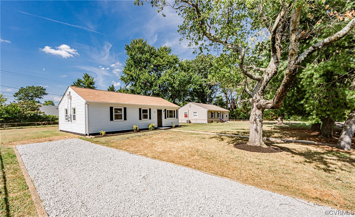 2310 Apollo Road Richmond, VA 23223 - Photo 3 of 22 a house with trees in the background