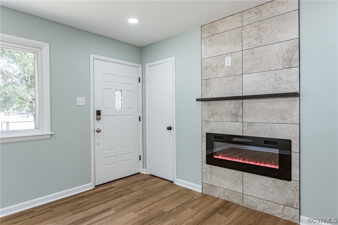 2310 Apollo Road Richmond, VA 23223 - Photo 5 of 22 a view of an empty room with wooden floor and a window