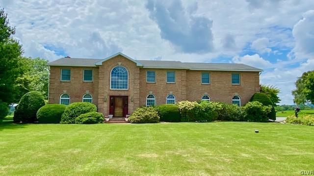 6273 Hower Road Pen Argyl, PA 18072 - Photo 1 of 37 a front view of a house with garden