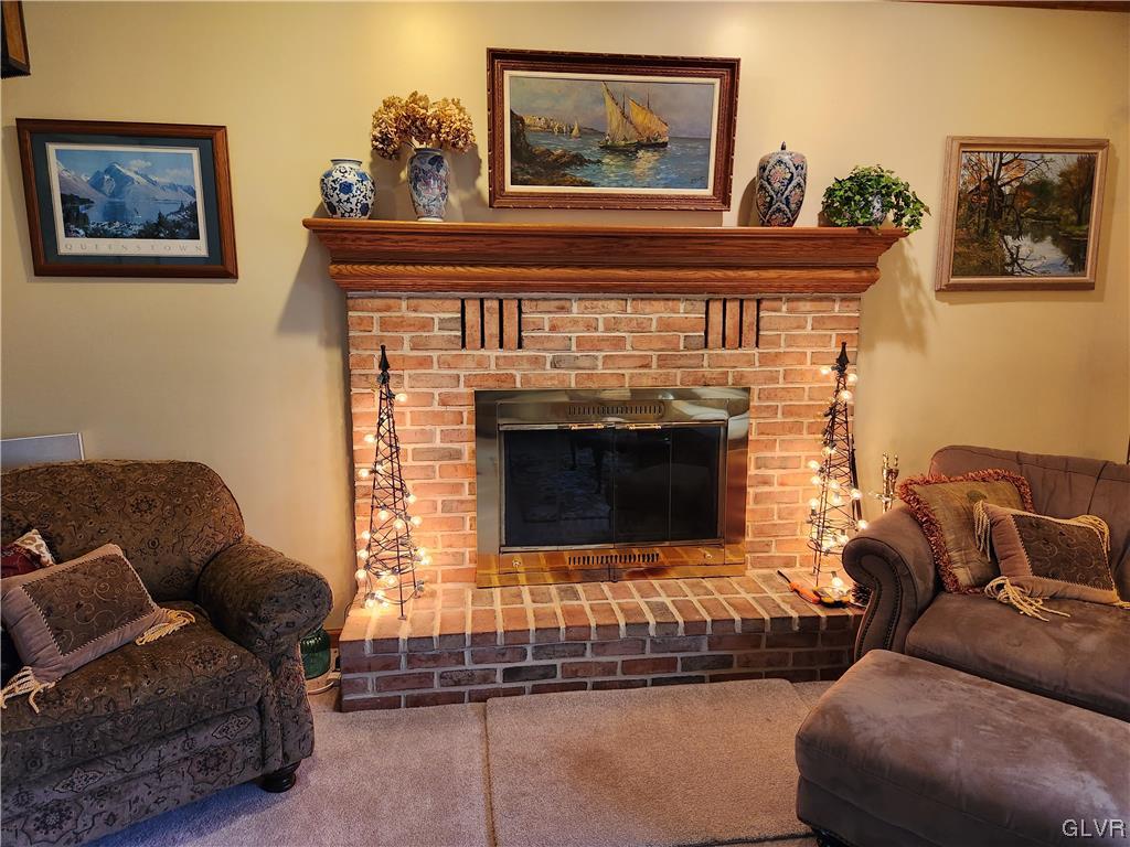 6273 Hower Road Pen Argyl, PA 18072 - Photo 13 of 37 a living room with furniture and a fireplace