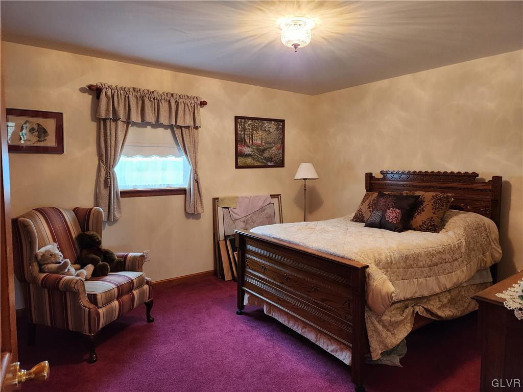 6273 Hower Road Pen Argyl, PA 18072 - Photo 18 of 37 a bedroom with a bed and window