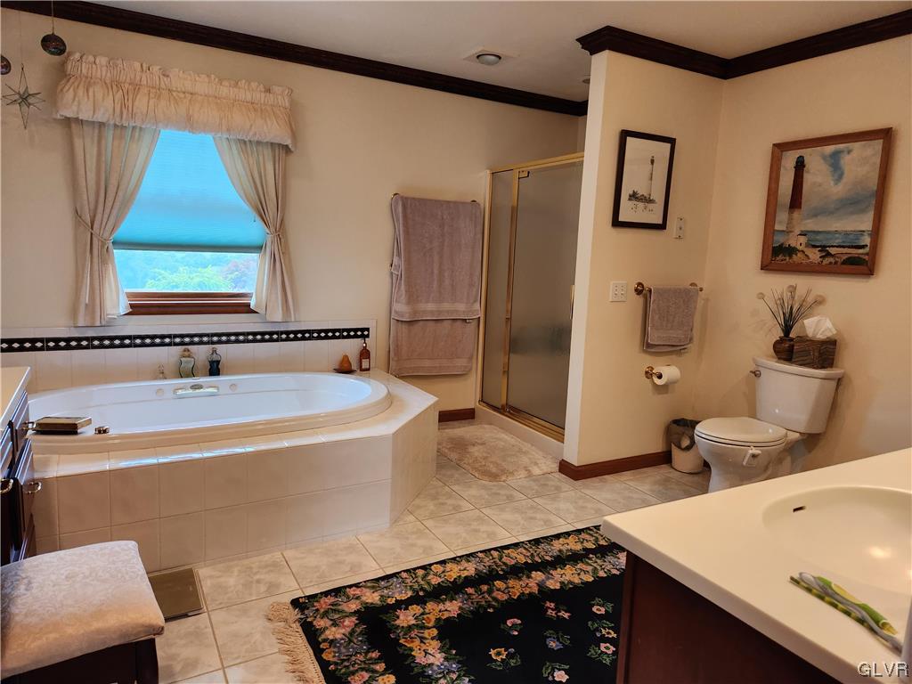 6273 Hower Road Pen Argyl, PA 18072 - Photo 19 of 37 a bathroom with a tub sink and mirror