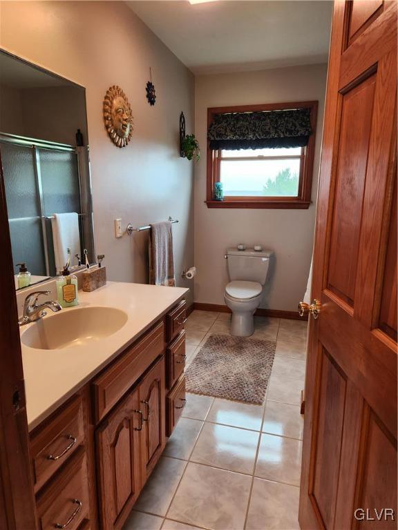 6273 Hower Road Pen Argyl, PA 18072 - Photo 22 of 37 a bathroom with a toilet sink and mirror