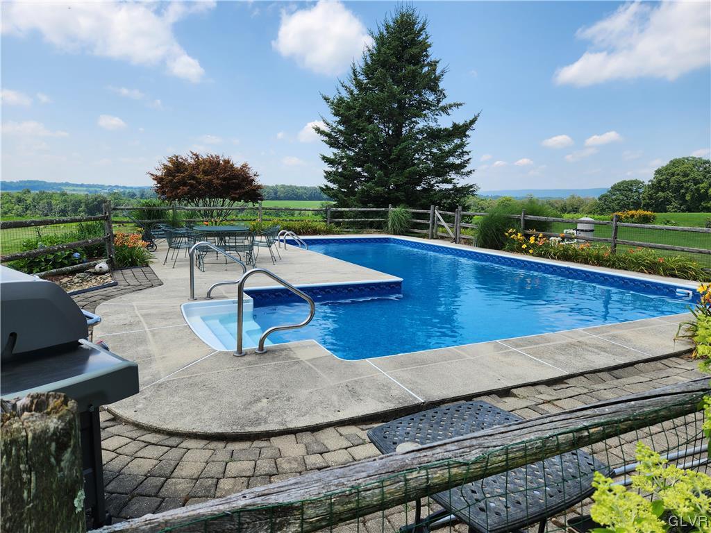 6273 Hower Road Pen Argyl, PA 18072 - Photo 3 of 37 a view of a swimming pool with a patio and a yard