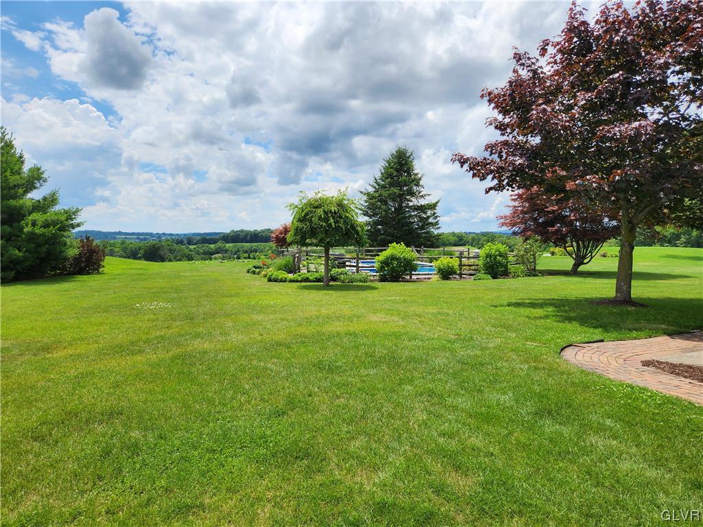 6273 Hower Road Pen Argyl, PA 18072 - Photo 31 of 37 a view of a garden with a building in the background