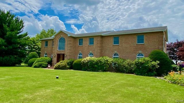 6273 Hower Road Pen Argyl, PA 18072 - Photo 36 of 37 a front view of a house with garden