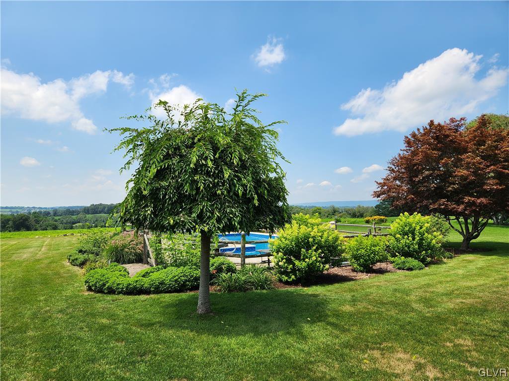 6273 Hower Road Pen Argyl, PA 18072 - Photo 37 of 37 a view of a garden with a fountain
