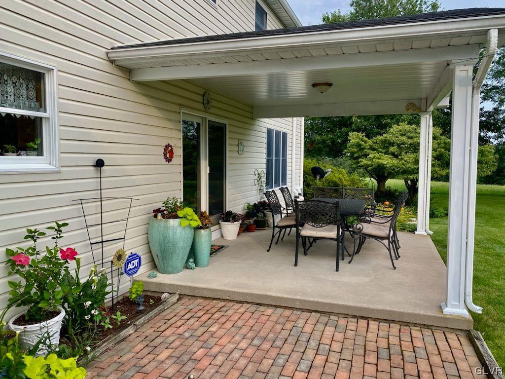 6273 Hower Road Pen Argyl, PA 18072 - Photo 5 of 37 a view of a patio with table and chairs and potted plants