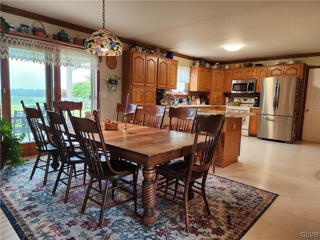 6273 Hower Road Pen Argyl, PA 18072 - Photo 10 of 37 a view of a dining room with furniture window and wooden floor