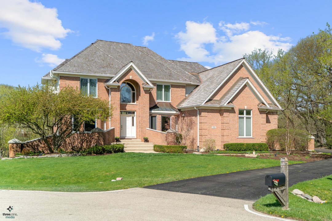 25484 North Countryside Court Lake Barrington, IL 60010 - Photo 1 of 26 a front view of a house with garden