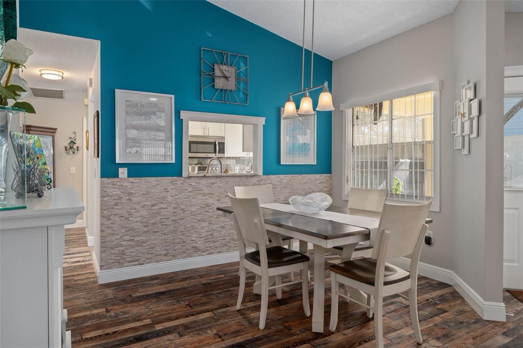 4749 Westbury Court, Unit 19 New Port Richey, FL 34655 - Photo 15 of 46 a view of a dining room with furniture and window