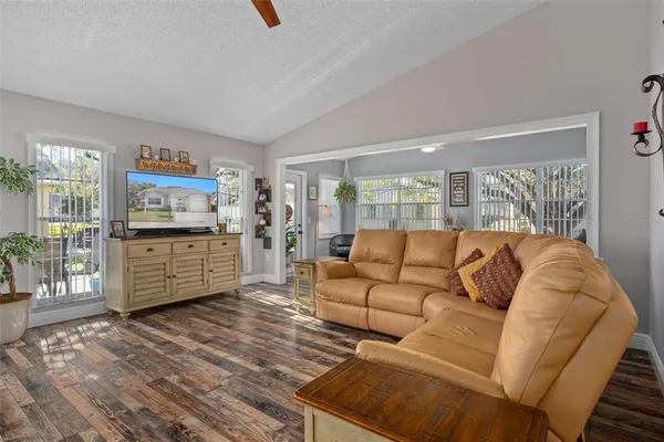 a living room with furniture and large window