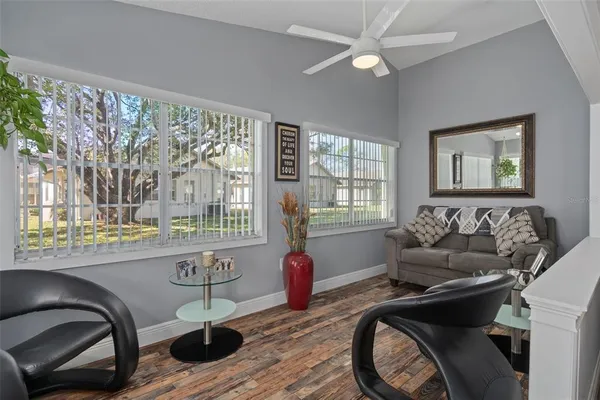 a living room with furniture and a large window