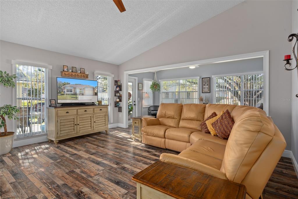 4749 Westbury Court, Unit 19 New Port Richey, FL 34655 - Photo 18 of 46 a living room with furniture and large window