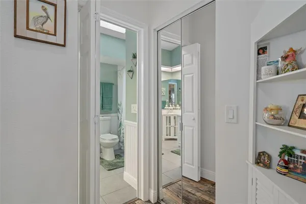 a view of bathroom with shower and hardwood floor
