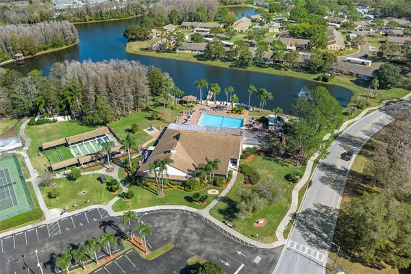 an aerial view of a house with a lake view