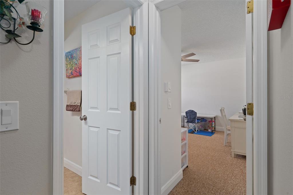 4749 Westbury Court, Unit 19 New Port Richey, FL 34655 - Photo 31 of 46 a view of kids room with bathroom