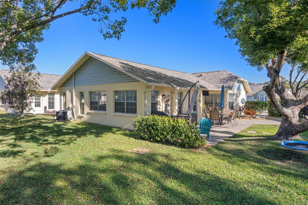 4749 Westbury Court, Unit 19 New Port Richey, FL 34655 - Photo 39 of 46 a front view of a house with a yard