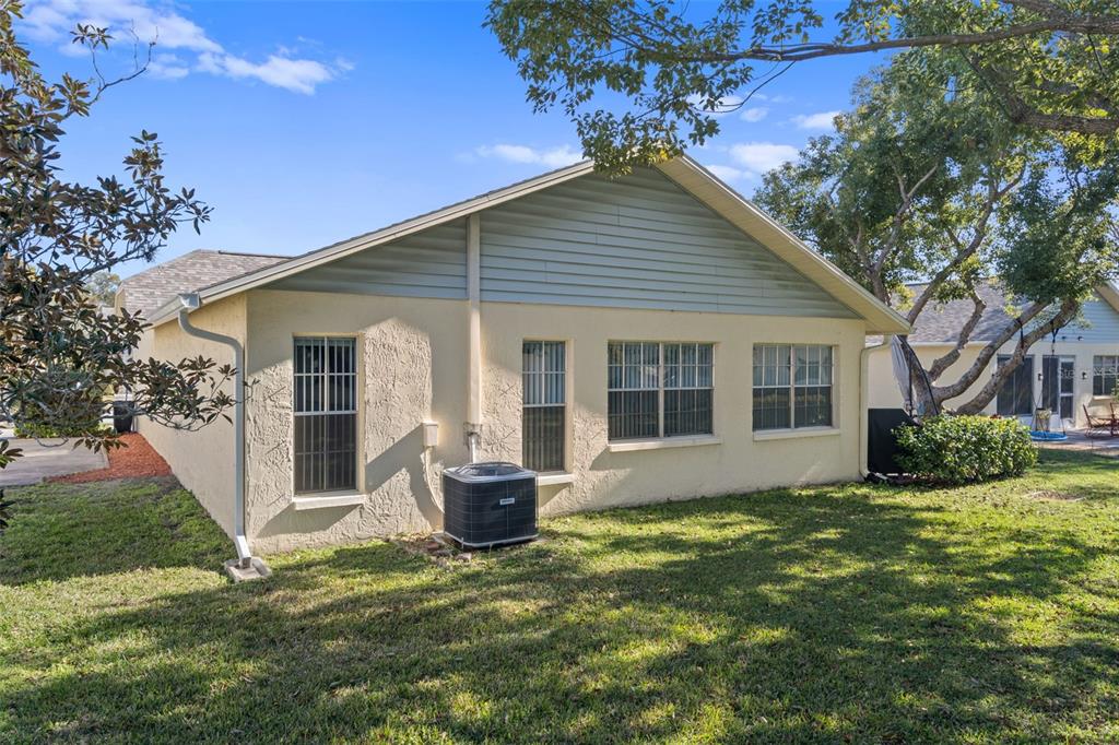 4749 Westbury Court, Unit 19 New Port Richey, FL 34655 - Photo 40 of 46 a front view of house with yard and green space