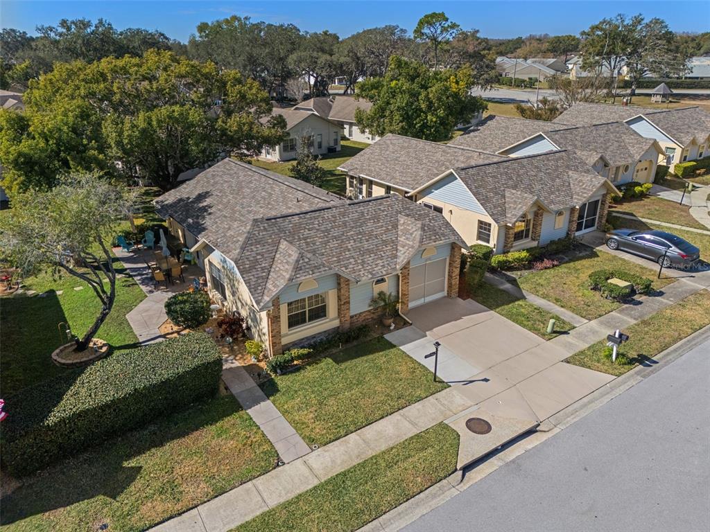 4749 Westbury Court, Unit 19 New Port Richey, FL 34655 - Photo 4 of 46 an aerial view of a house with a yard