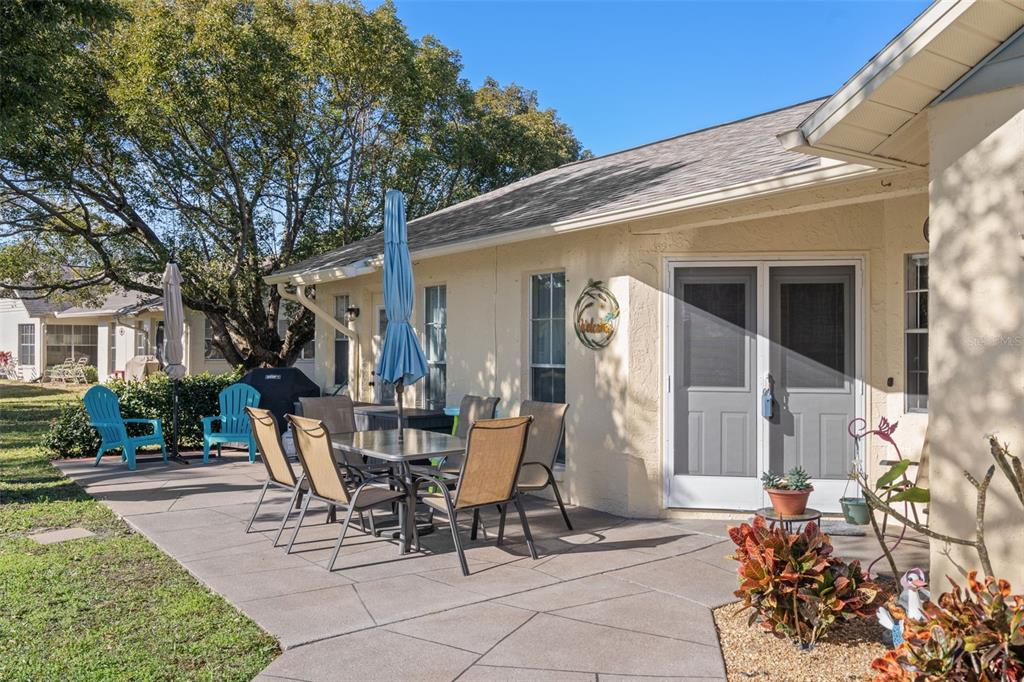 4749 Westbury Court, Unit 19 New Port Richey, FL 34655 - Photo 7 of 46 a view of a patio with table and chairs and potted plants