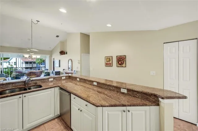 a kitchen with a sink and a refrigerator