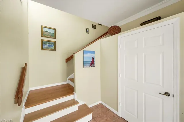 a view of a lake with houses in the background