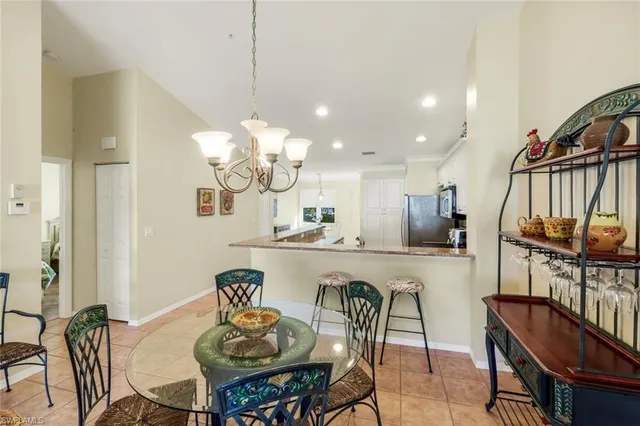 a kitchen with a table chairs stove and microwave