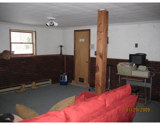 64 Wheeler Road Princeton, MA 01541 - Photo 13 of 13 a bedroom with a bed and a window