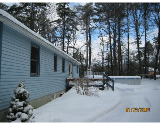 64 Wheeler Road Princeton, MA 01541 - Photo 3 of 13 a backyard of a house with table and chairs