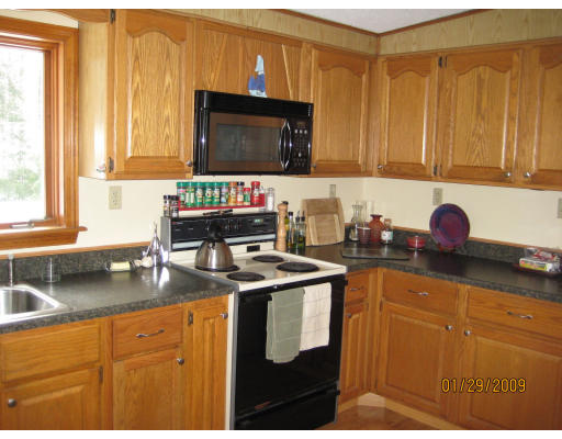 64 Wheeler Road Princeton, MA 01541 - Photo 4 of 13 a kitchen with granite countertop a sink a stove and cabinets