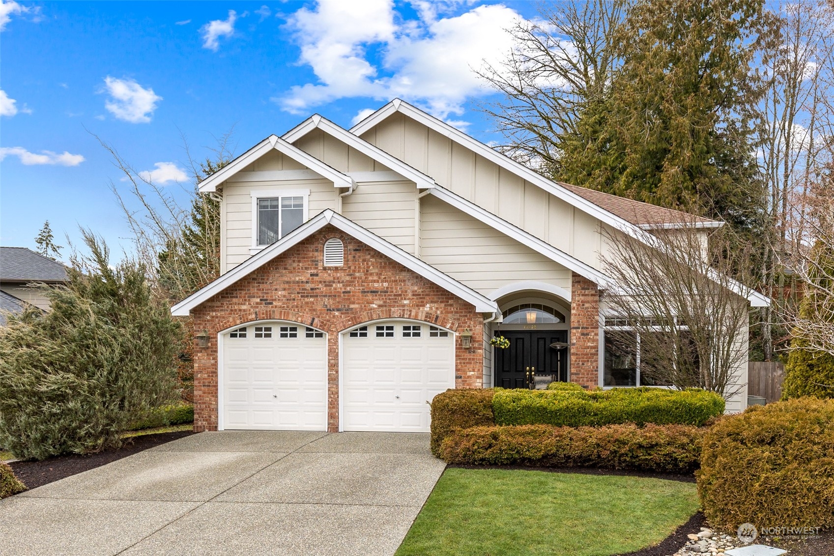 17110 16th Avenue Southeast Bothell, WA 98012 - Photo 1 of 28 a front view of a house with a garden