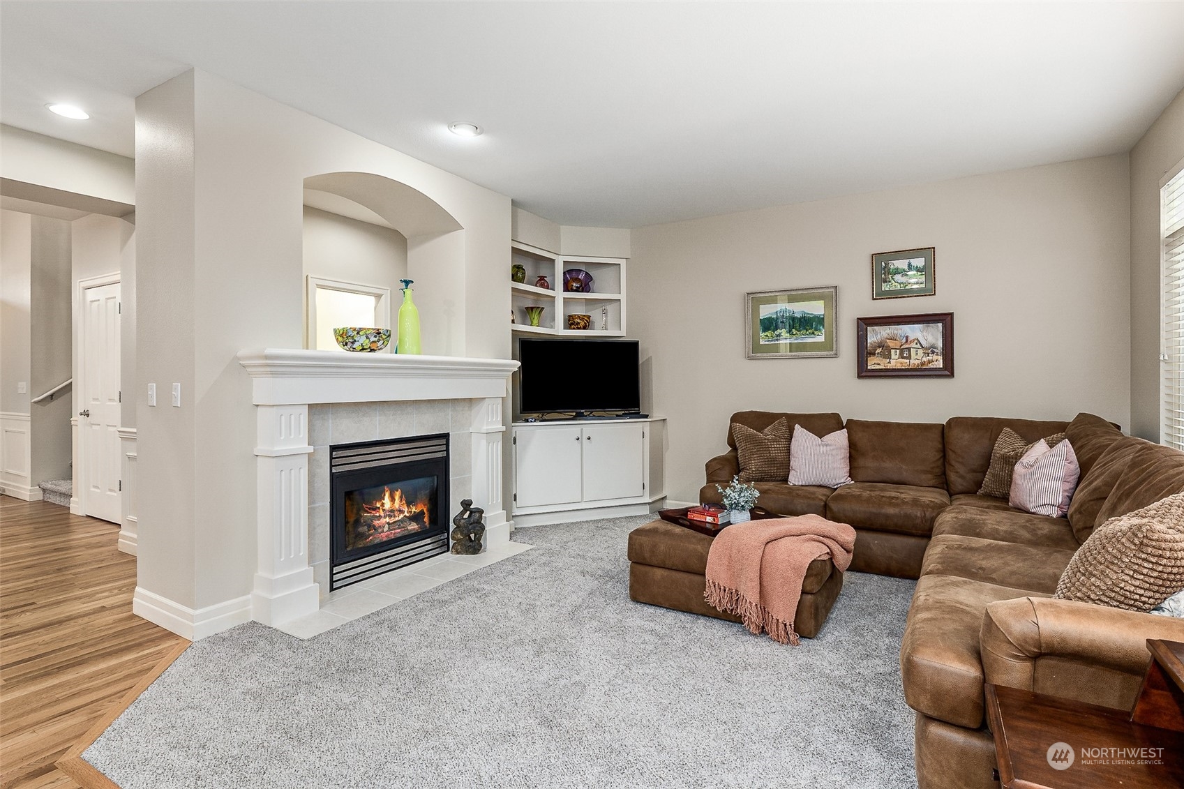 17110 16th Avenue Southeast Bothell, WA 98012 - Photo 15 of 28 a living room with furniture a flat screen tv and a fireplace
