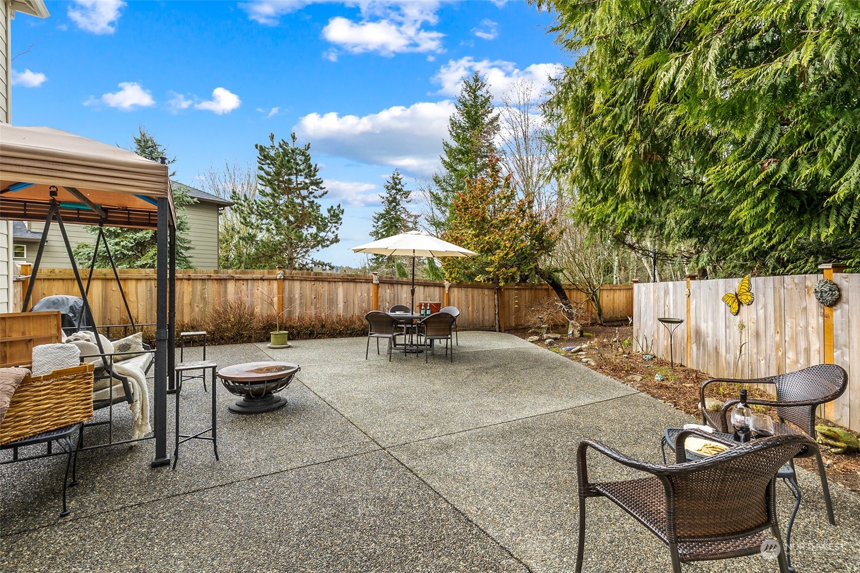 17110 16th Avenue Southeast Bothell, WA 98012 - Photo 3 of 28 a view of a patio with table and chairs and potted plants