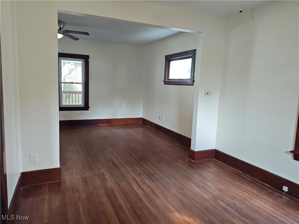5213 Reed Avenue Ashtabula, OH 44004 - Photo 13 of 35 Empty room featuring a ceiling fan and dark wood-type flooring