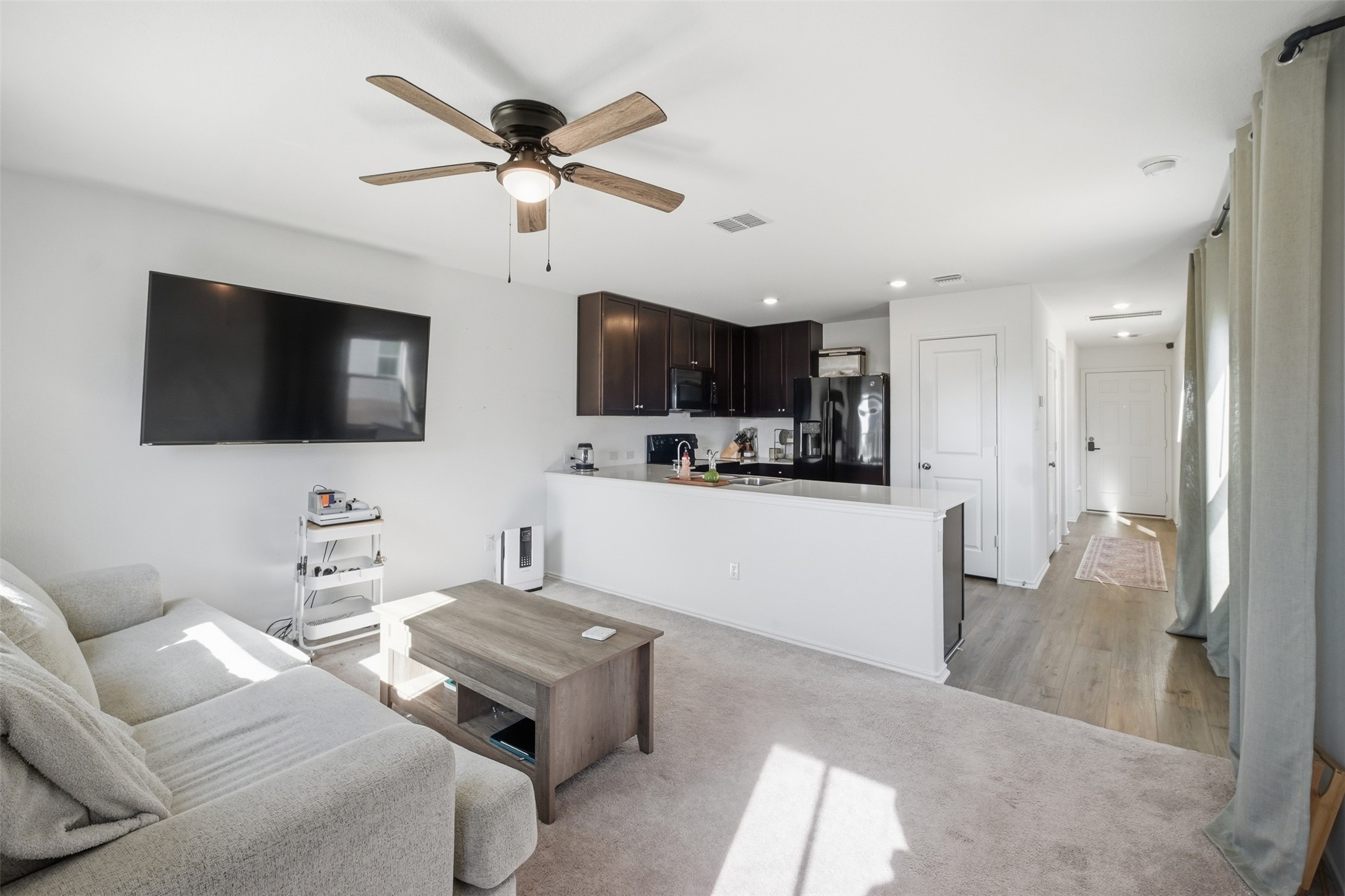 625 Marty Allen Loop Jarrell, TX 76537 - Photo 12 of 25 a living room with furniture and a flat screen tv