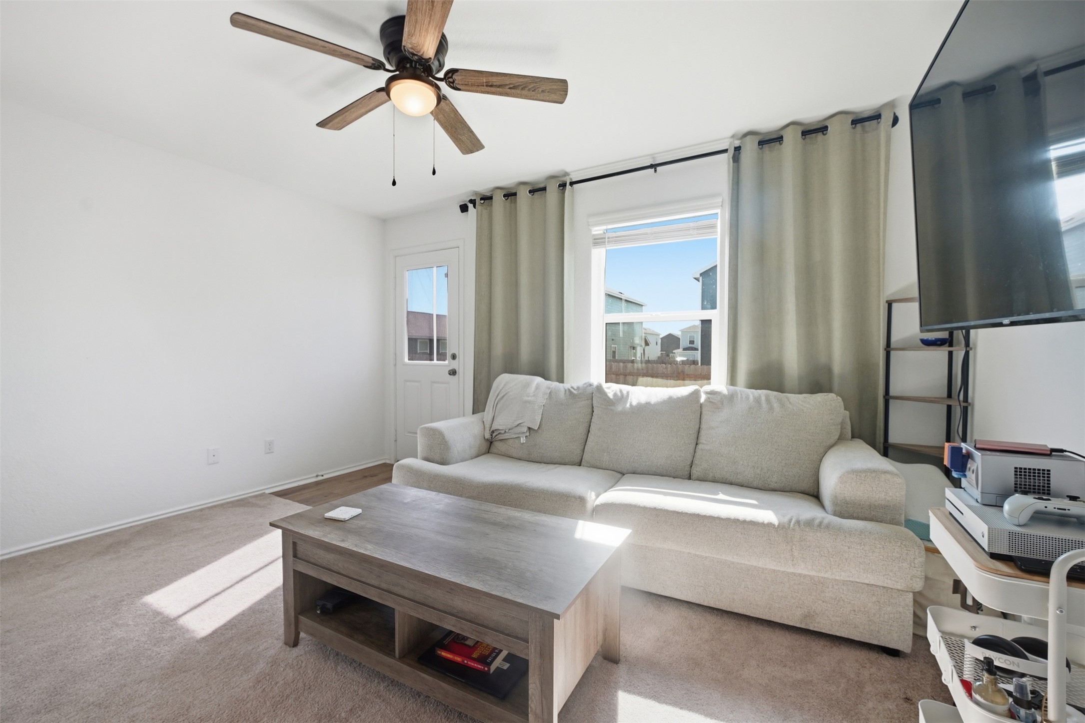 625 Marty Allen Loop Jarrell, TX 76537 - Photo 14 of 25 a living room with furniture and a chandelier