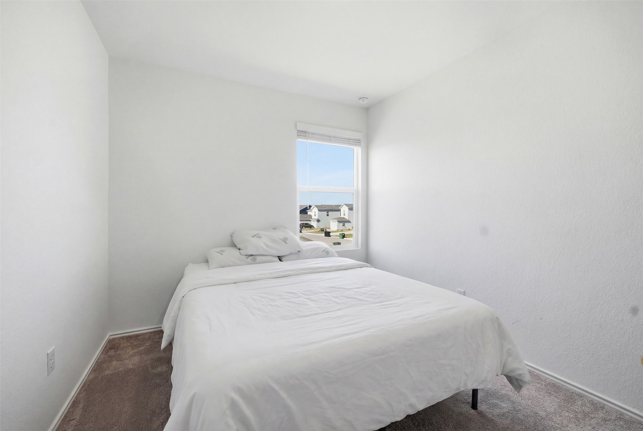 625 Marty Allen Loop Jarrell, TX 76537 - Photo 16 of 25 a bedroom with a bed and a night stand