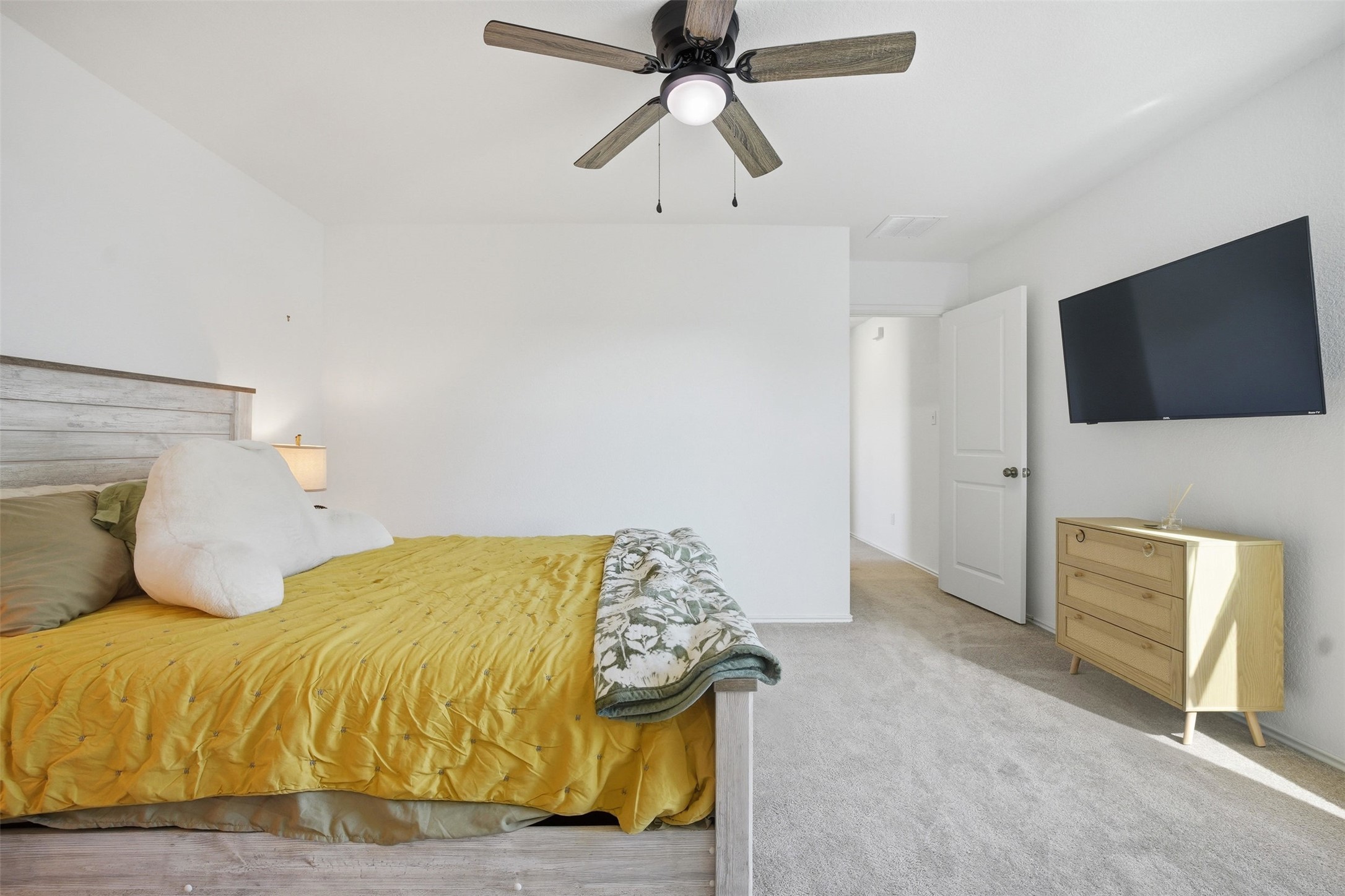 625 Marty Allen Loop Jarrell, TX 76537 - Photo 19 of 25 a bedroom with a bed and a flat screen tv